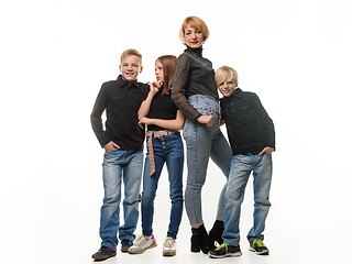 Image showing Mom with three teenagers, two boys and a girl, isolated on a white background
