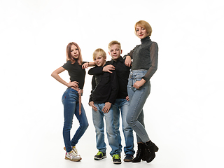 Image showing Mom and three children, two boys and a girl, in full growth, isolated on a white background