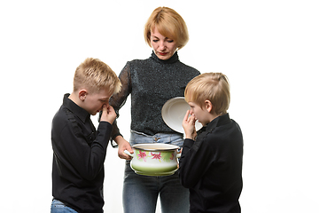 Image showing The children did not like the food cooked by their mother