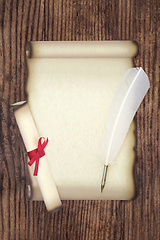 Image showing Parchment Paper Scroll with White Feather Quill Pen  