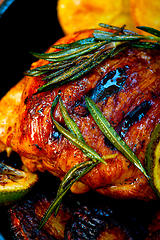 Image showing roasted grilled BBQ chicken breast with herbs and spices