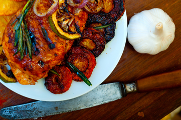 Image showing roasted grilled BBQ chicken breast with herbs and spices