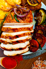 Image showing roasted grilled BBQ chicken breast with herbs and spices