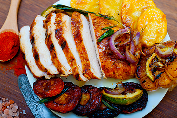 Image showing roasted grilled BBQ chicken breast with herbs and spices