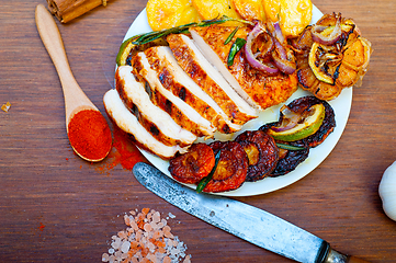 Image showing roasted grilled BBQ chicken breast with herbs and spices