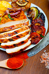 Image showing roasted grilled BBQ chicken breast with herbs and spices