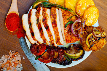 Image showing roasted grilled BBQ chicken breast with herbs and spices