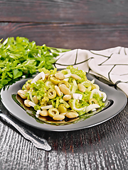 Image showing Salad of beans and olives in plate on wooden board