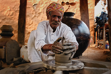 Image showing Indian potter at work. Handwork craft from Shilpagram, Udaipur, Rajasthan, India