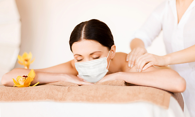 Image showing woman lying and having back massage at spa