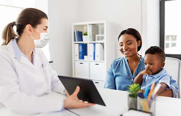 Image showing mother, baby and doctor in mask with tablet pc