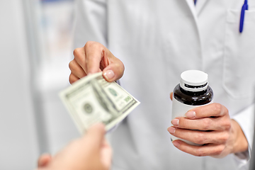 Image showing close up of pharmacist selling drug at pharmacy