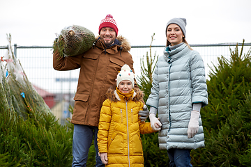 Image showing happy family buying christmas tree at market