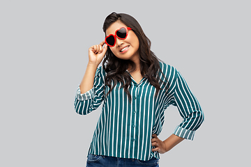 Image showing happy asian woman with in heart shaped sunglasses