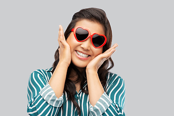 Image showing happy asian woman with in heart shaped sunglasses