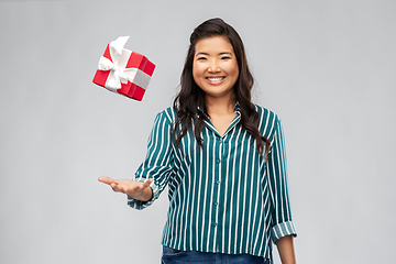 Image showing happy asian woman with birthday present