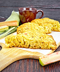 Image showing Scones with rhubarb on dark wooden board