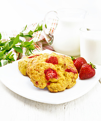 Image showing Scones with strawberry in plate on light board