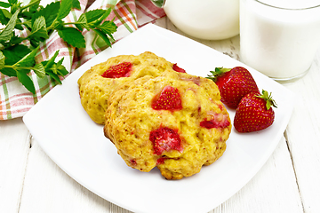 Image showing Scones with strawberry in plate on wooden board