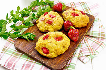 Image showing Scones with strawberry on board