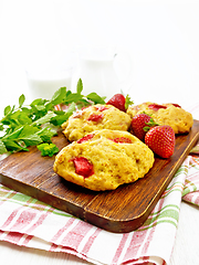 Image showing Scones with strawberry on wooden board