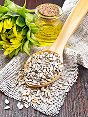 Image showing Seeds sunflower peeled in spoon on board