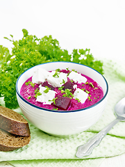 Image showing Soup puree of beetroot with feta in bowl on white board