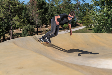 Image showing Skateboarder on a pump track park