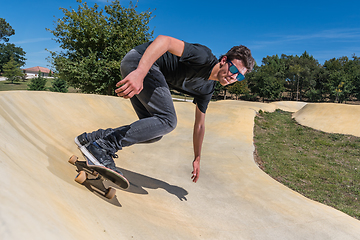 Image showing Skateboarder on a pump track park