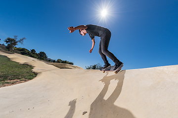 Image showing Skateboarder on a pump track park