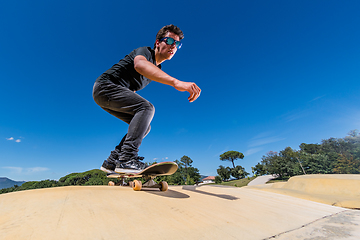 Image showing Skateboarder on a pump track park