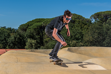 Image showing Skateboarder on a pump track park