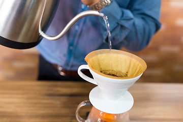 Image showing Barista making a drip coffee