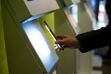 Image showing Woman scanning on the payment machine by NFC