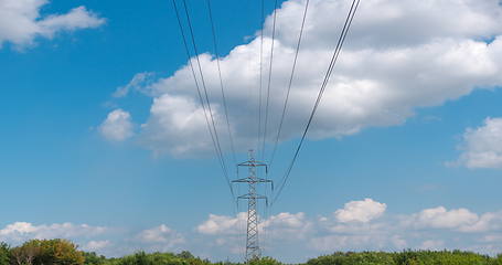 Image showing cloudy morning sky and a high-voltage line