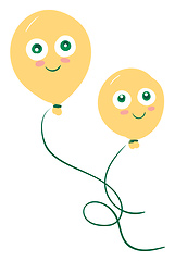 Image showing Two green eyed yellow balloons tied to individual strings with b