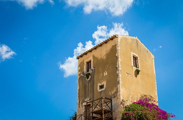 Image showing Sicily, Italy. Old house with purple flowers in Syracuse.