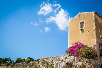 Image showing Sicily, Italy. Old house with purple flowers in Syracuse.