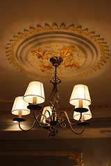 Image showing Beautiful sparlking chandelier under the ceiling
