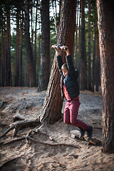 Image showing Teen boy at bungee in autumn forest