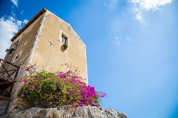 Image showing Sicily, Italy. Old house with purple flowers in Syracuse.