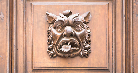 Image showing Italy - Mask on an old door