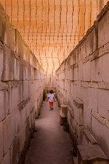 Image showing Lonely young boy walking in a corridor