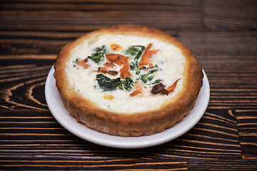 Image showing Salmon pie on wooden