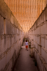 Image showing Lonely young boy walking in a corridor