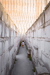 Image showing Lonely young boy walking in a corridor