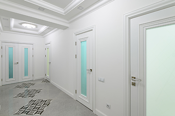 Image showing interior of white hallway with doors