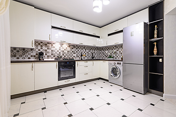 Image showing Brown and white modern kitchen interior