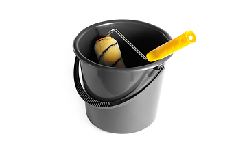 Image showing Paint roller in a bucket.