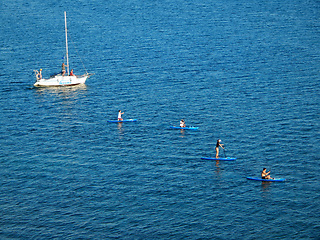 Image showing Riding on inflatable boards.